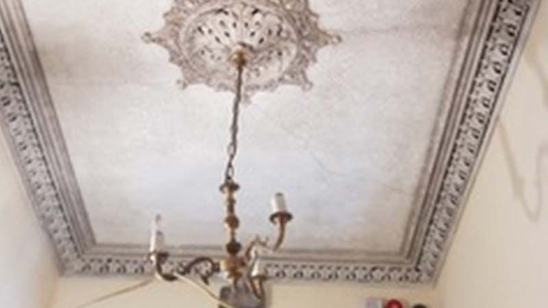 Intumescent lath and plaster coating for ceilings applied to decorative ceiling